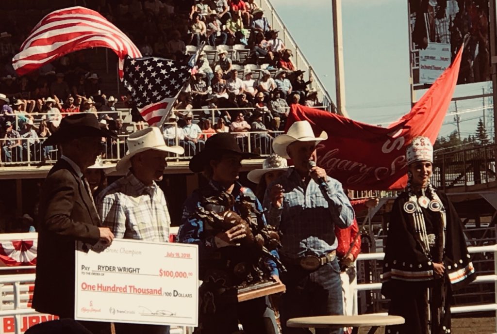 Giving out prizes at the Rodeo, during the Calgary Stampede.